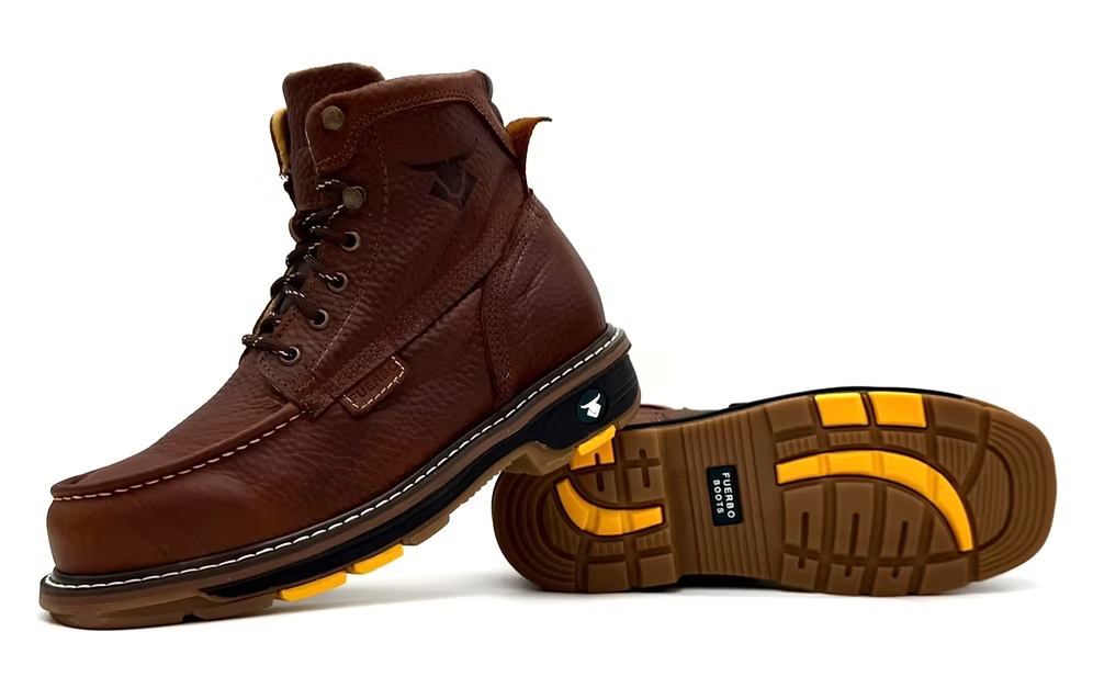Brown leather boots with yellow sole on a white background