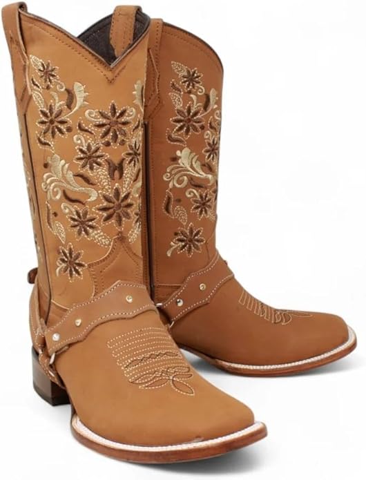 Tan cowboy boots with intricate floral embroidery on a white background