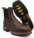 Brown leather boot with yellow accents on sole on a white background