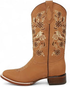 tan cowboy boot with intricate floral embroidery on a white background