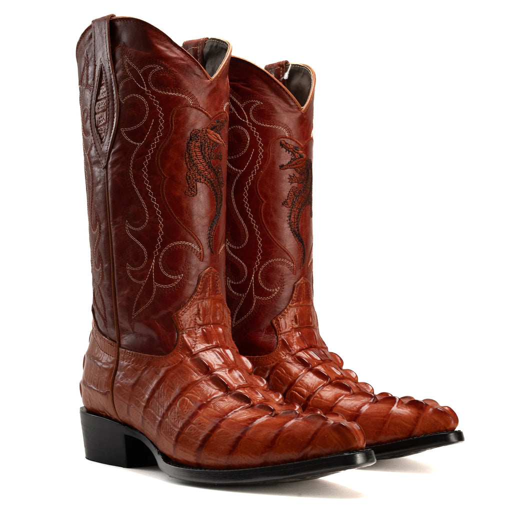 Close-up of caiman print leather texture on cowboy boots
