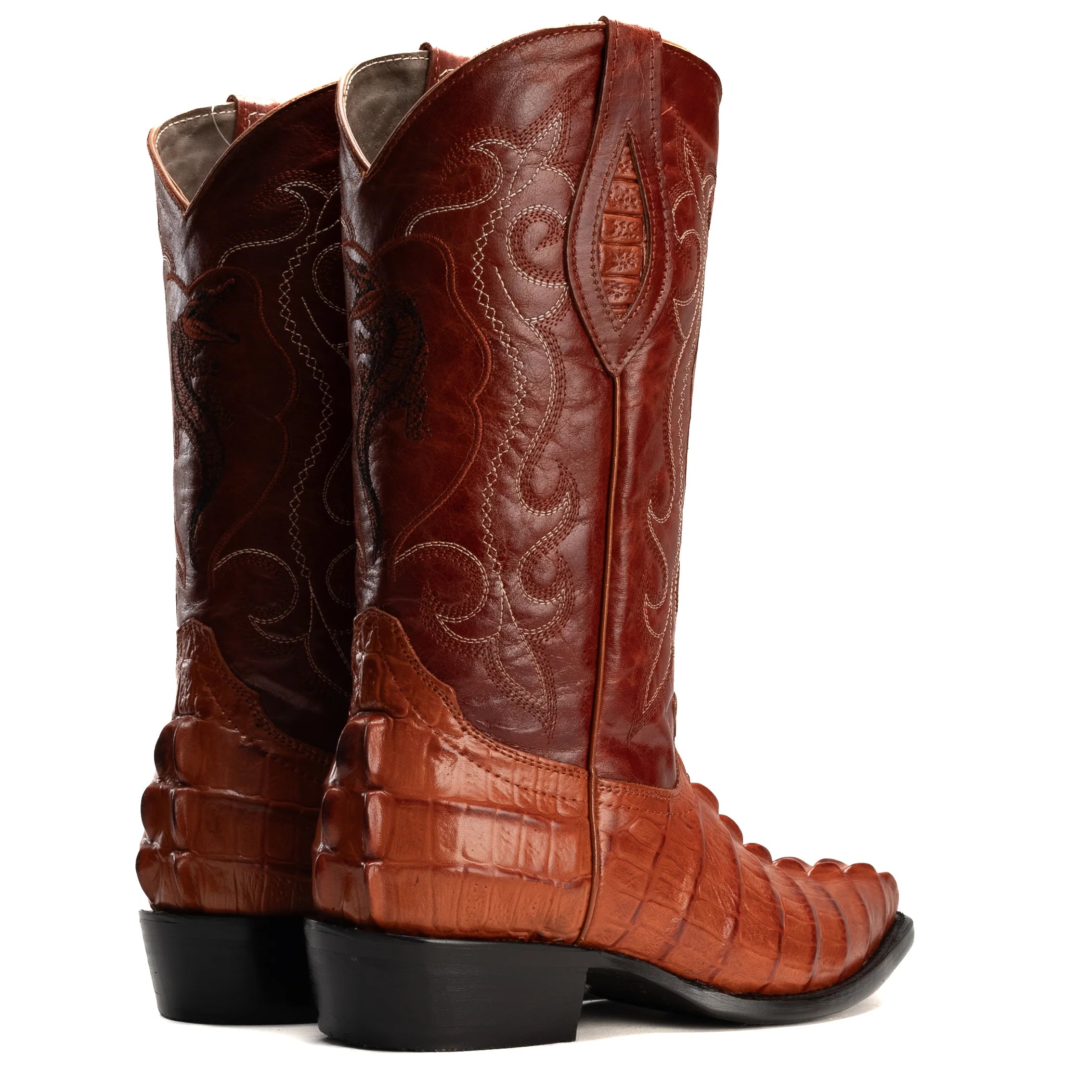 Pair of brown leather cowboy boots with detailed design on a white background