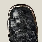 Close-up of a mummified cat in a wooden coffin on a beige background