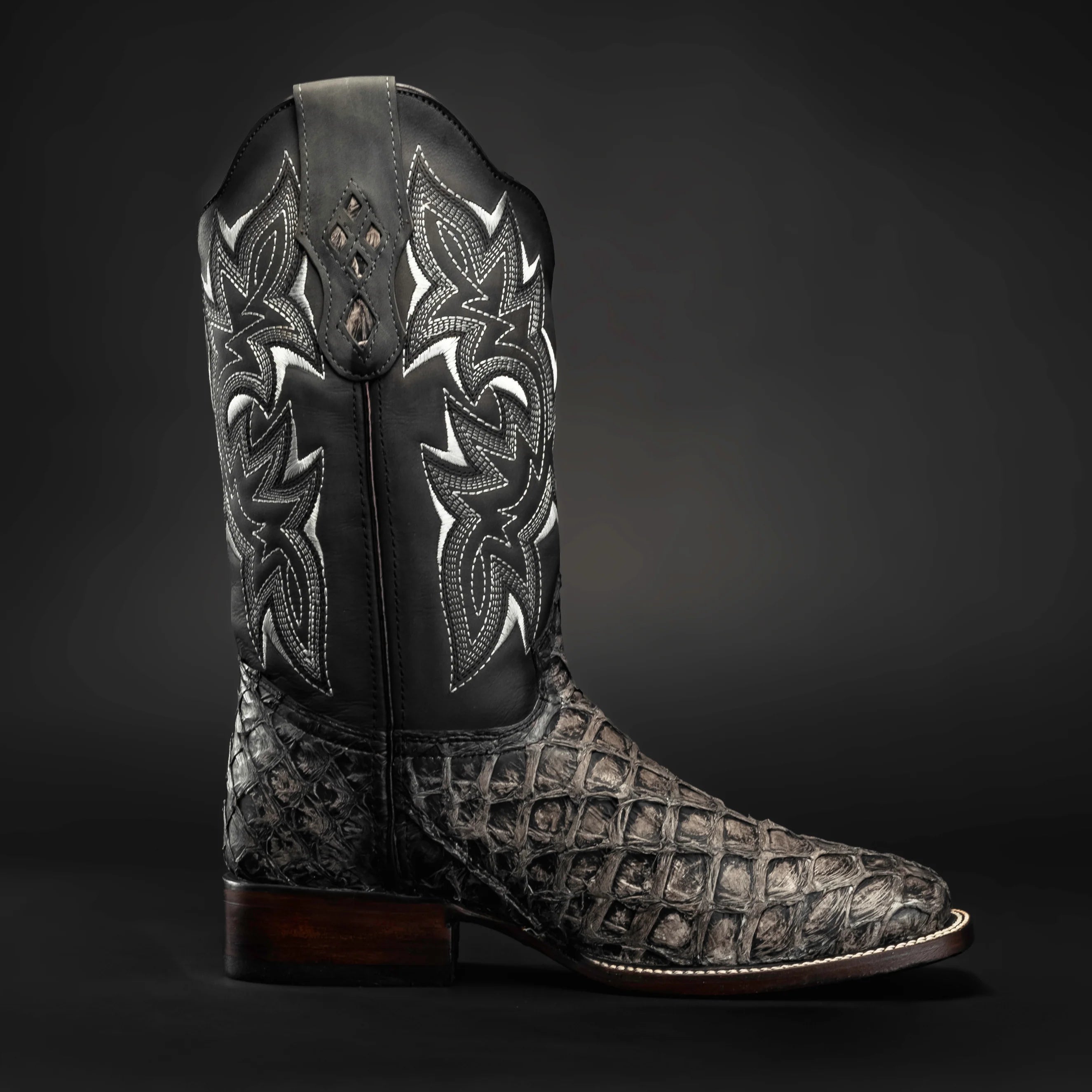 Side profile of men’s black pirarucu square toe cowboy boots