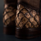 Close-up of genuine pirarucu leather texture on oryx cowboy boots