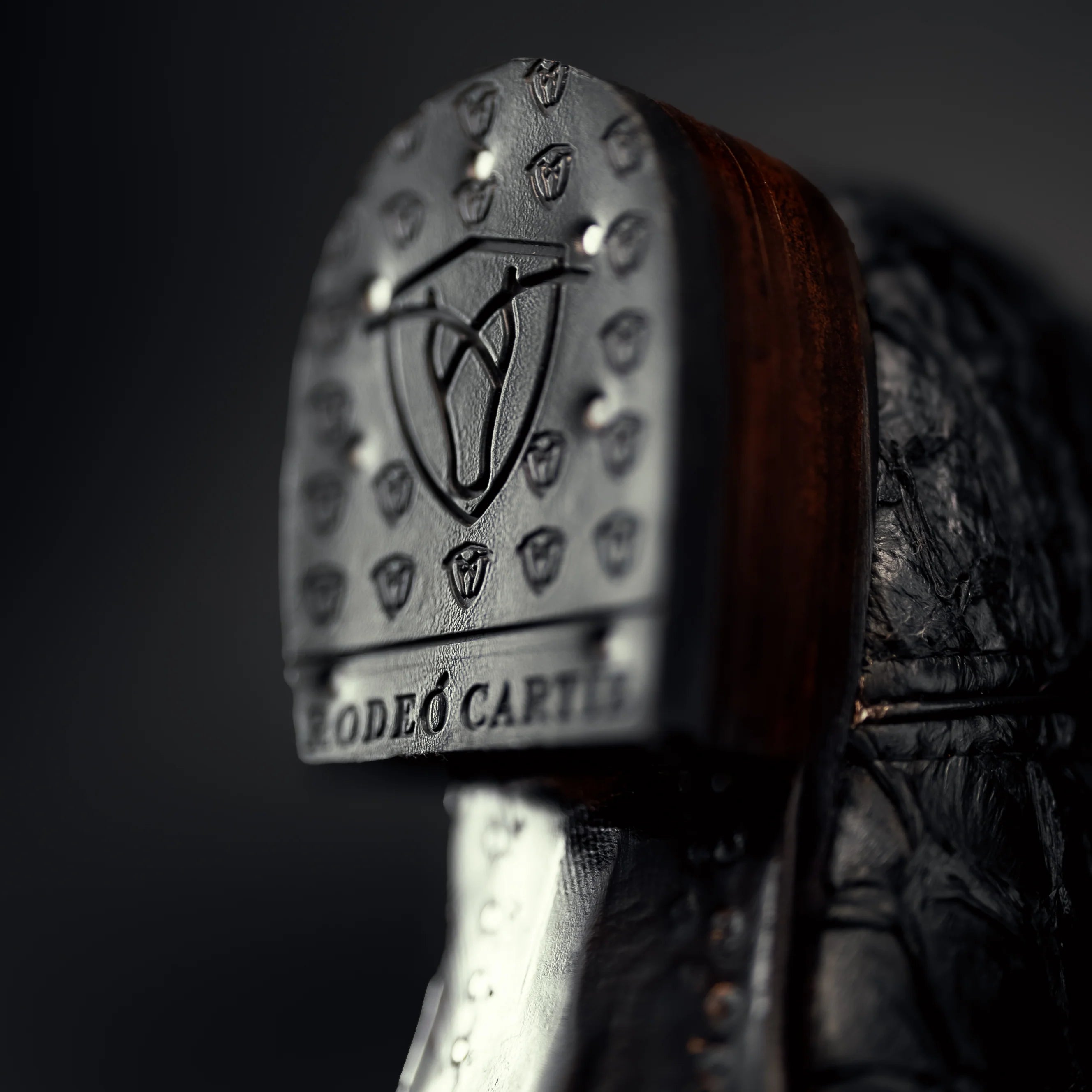 Close-up of a boot with 'Rodeo Carter' branding on a dark background