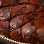 Close-up of a textured brown surface with a blurred background