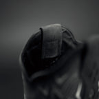 Close-up of a dark-colored jleather shoe