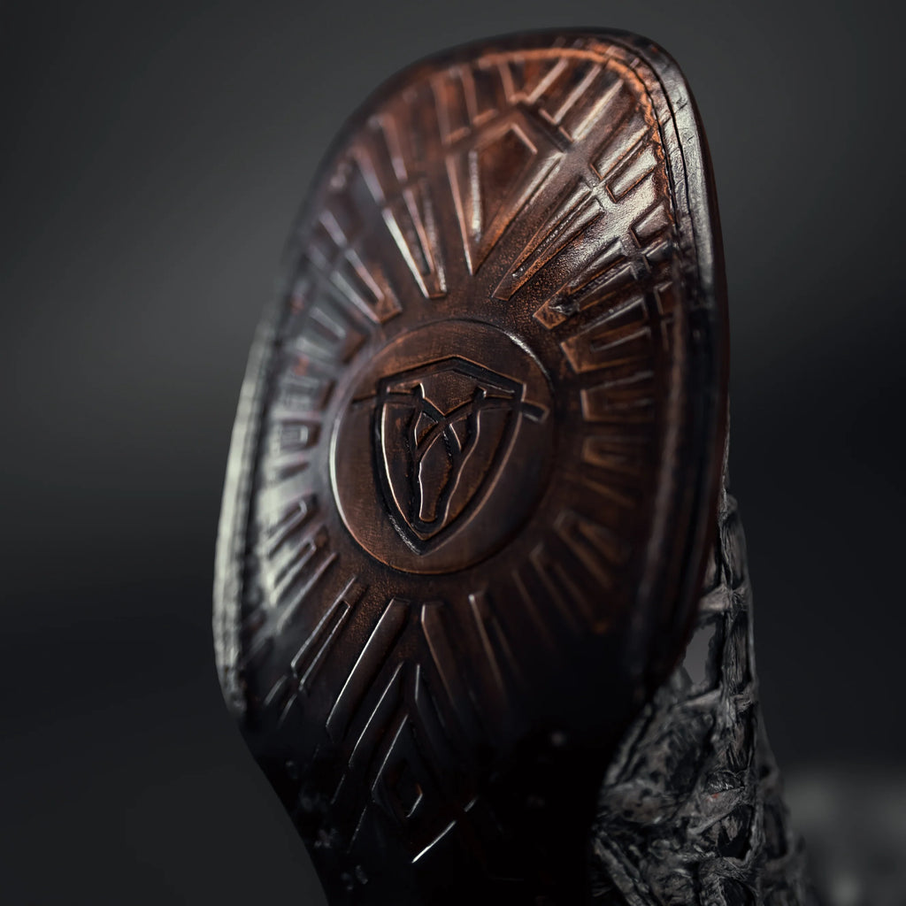 Durable sole on men’s black pirarucu square toe cowboy boots
