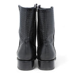 Pair of black leather boots on a white background