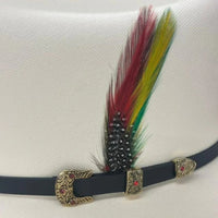 Decorative belt with colorful feathers and ornate buckle on a white background